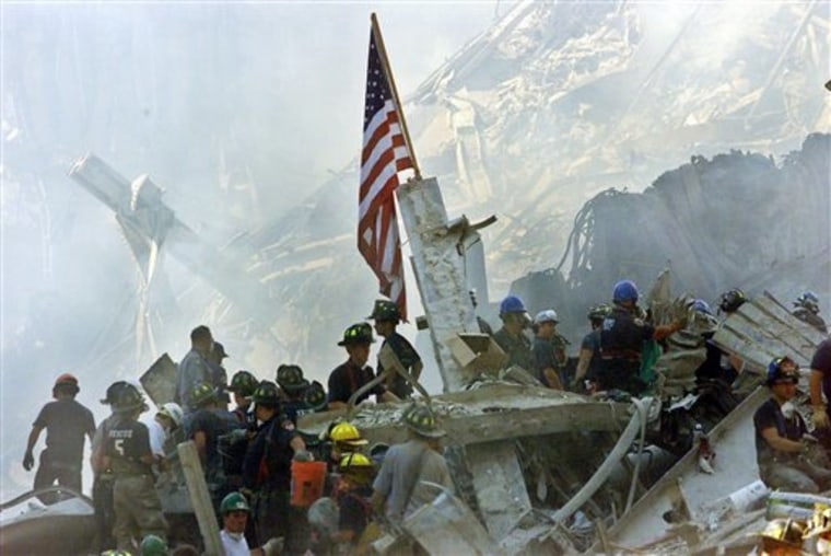 An American flag flies over the rubble of the World Trade Center in New York after the Sept. 11 attacks.